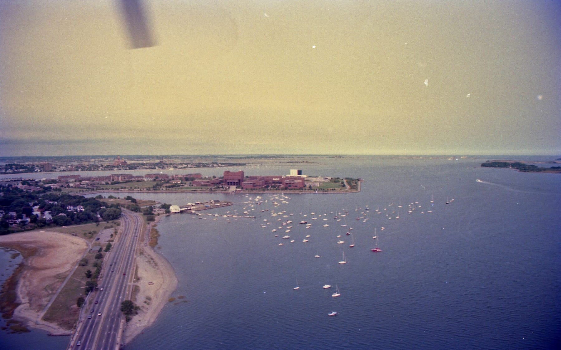 Aerial view of Morrissey Boulevard and UMass Boston, September 1993 (photograph from the Wikimedia Commons category University of Massachusetts Boston)